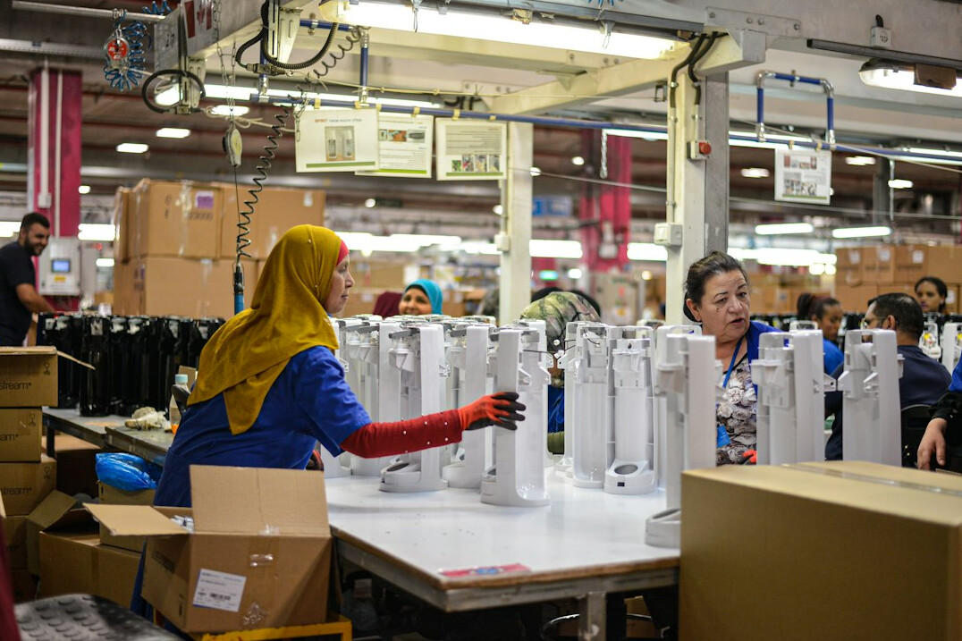 Warehouse workers sorting packages