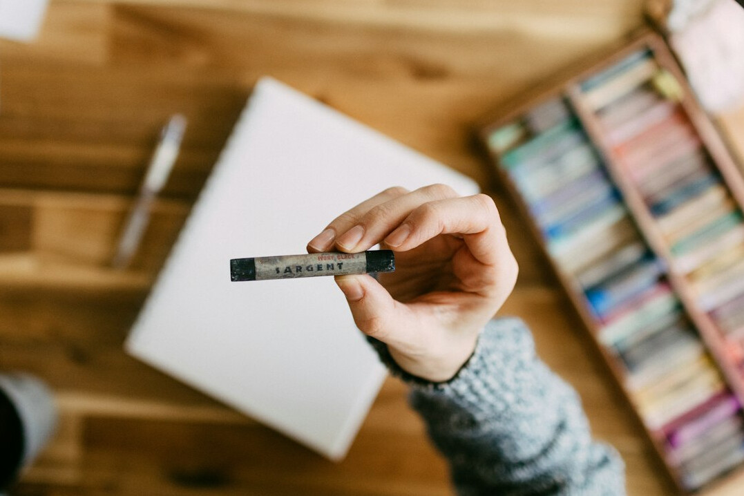 Hands reviewing documents with a highlighter