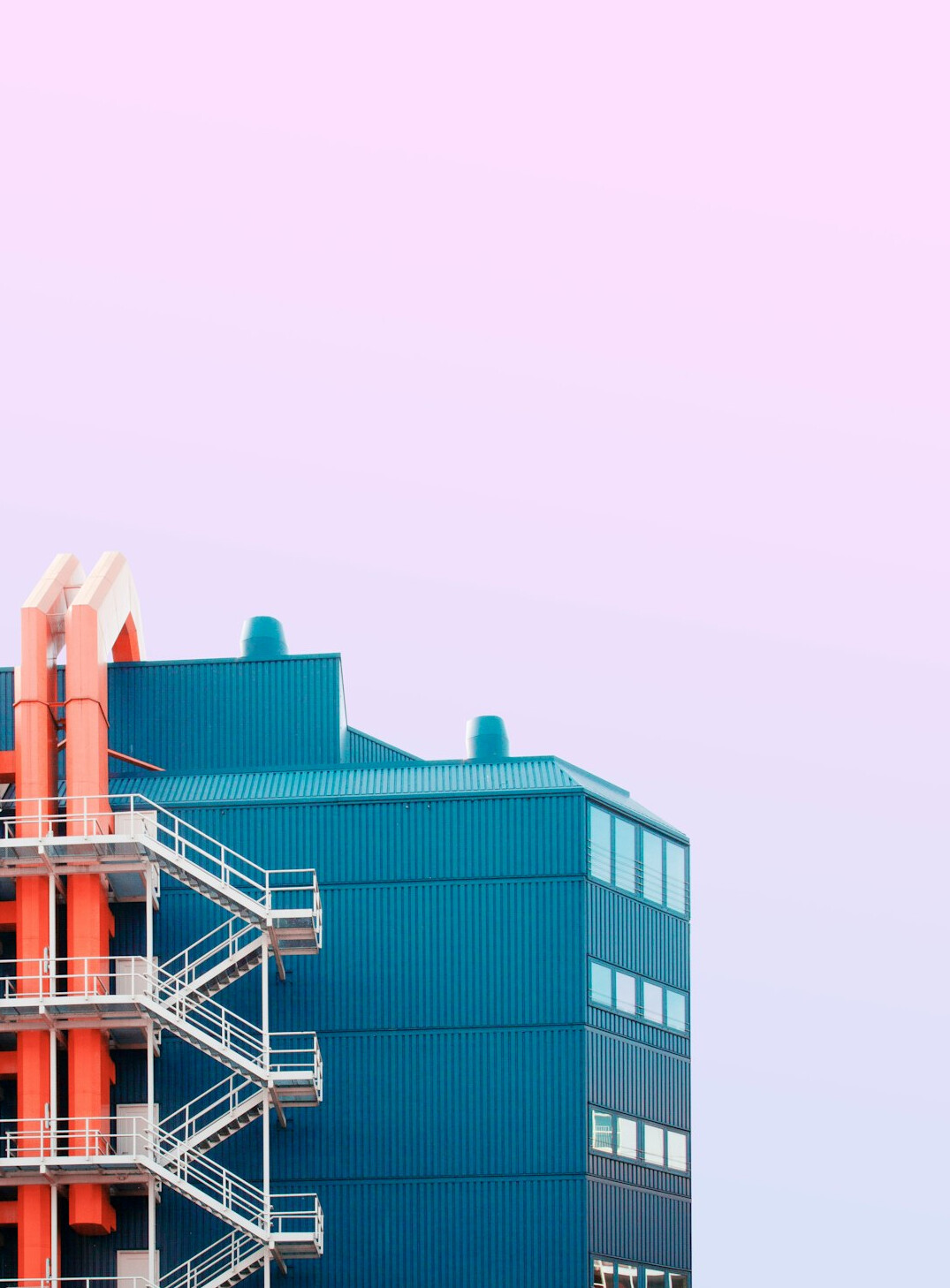 Industrial factory exterior with smokestacks
